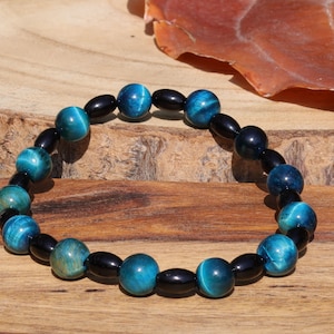 Natural Black Agate Barrel Beads with  Blue Tiger Eye, also known as Hawk&#39;s Eye beads. making it a beneficial stone for students and artists