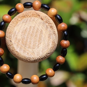 Unique Madre de Cacao Wood bracelet combined with Natural Black Agate Barrel Beads. Most favored botanical medicines in South America