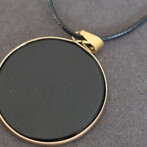 Black mirror Obsidian Natural Stone Disc Shape Pendant.Obsidian Natural Stone Disc Shape Pendant, often referred to as a black mirror image 7