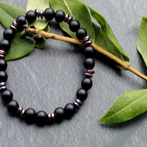 Curious matte Agate combined with Grade A Non-magnetic Hematite Rondelle Multi-Color Plated.  Strung on durable stretchy cord