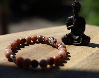 Striking Cherry Blossom Jasper and Rudraksha beads bracelet. Combined with Silver Plated Buddha. 'one who is awake'