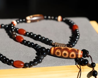 Extraordinary Guan Yin beaded necklace with Agate five-eye dZi beads. Helps to bring peace and reconciliation to a person