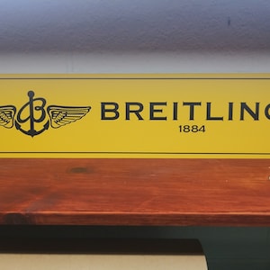 Letrero de aluminio BREITLING de 6" x 24"