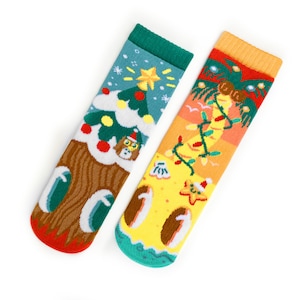 May include: Two colorful Christmas-themed socks. One sock features a Christmas tree with a star, snow, and a dog wearing a Santa hat. The other sock has a beach scene with palm trees, lights, and a starfish wearing a Santa hat.