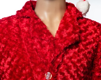 May include: A red fuzzy robe with a white trim collar and two silver buttons. The robe is worn by a mannequin wearing a red Santa hat.