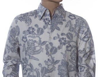 May include: A long-sleeved button-down shirt with a white background and a blue floral pattern.