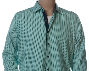 May include: A light green long-sleeved button-down shirt with a black polka dot pattern. The shirt has a dark blue collar and cuffs.