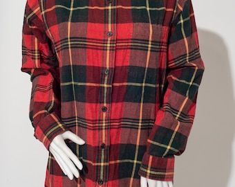May include: A red, black, and yellow plaid flannel shirt with long sleeves and a button-up front.