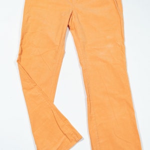 May include: A pair of orange corduroy pants with a straight leg fit.
