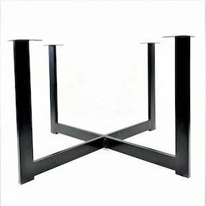 May include: Black metal table base with four legs and a cross-shaped support structure.