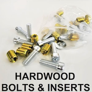 May include: A close-up of a bag of silver and gold metal bolts and inserts. The bag is open and the bolts and inserts are spilling out. The text "HARDWOOD BOLTS & INSERTS" is printed below the image.