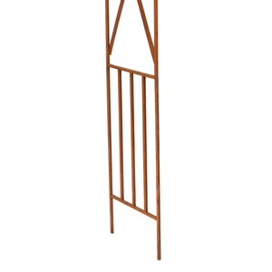 a wooden structure with vertical bars and a triangular opening at the top.