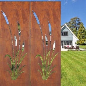 a rust-colored metal screen with a design of reeds or grasses on it, set against a backdrop of a well-maintained lawn and a house surrounded by trees.