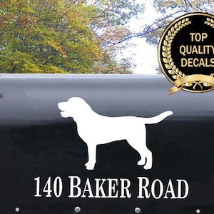 May include: A white silhouette of a dog is on a black mailbox with the address "140 Baker Road" in white lettering. A gold wreath with the text "Top Quality Decals" is in the upper right corner of the image.