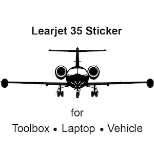 May include: Black silhouette of a Learjet 35 airplane. The text "Learjet 35 Sticker" is above the airplane. The text "for Toolbox • Laptop • Vehicle" is below the airplane.