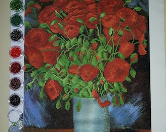 May include: A diamond painting kit featuring a bouquet of red poppies in a light blue vase against a dark background. The canvas displays a grid pattern of the floral arrangement, accompanied by a vertical column of twelve small circular containers.