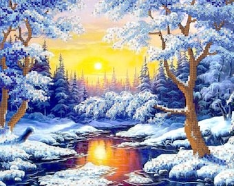 May include: A diamond painting kit featuring a winter landscape with snow-covered trees and a flowing river. The scene depicts a bright yellow sun rising over a forest, with sparkling blue and white crystals creating a textured, mosaic-like effect.