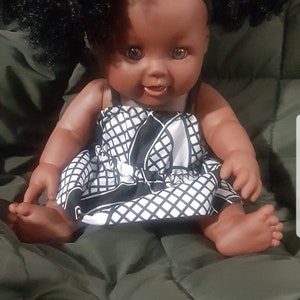 Beautiful Black Afro doll in handmade black and white African Print Top and skirt
