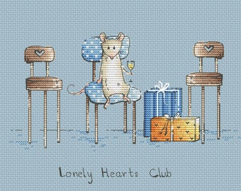 May include: A light blue background with a mouse sitting on a blue and white patterned chair. The mouse is holding a glass of wine. There are two empty chairs and two wrapped gifts on the floor. The text "Lonely Hearts Club" is written below the chairs.