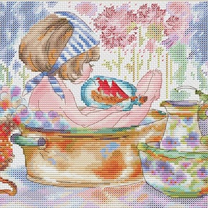 May include: A girl with brown hair and a blue and white striped headband is taking a bath in a copper tub. She is holding a toy boat in her hand. There is a pitcher and a bowl with floral designs on the side of the tub.