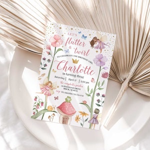 May include: A pink and gold fairy-themed birthday invitation with a whimsical illustration of fairies, flowers, and a mushroom house. The text reads "Let's flutter & twirl to celebrate the birthday girl Charlotte is turning three. Saturday, April 17, 2:00 pm, the Campbell's garden, 30 Pinewood Drive, Brick, NJ 08723. RSVP to Amanda 732-555-0123."