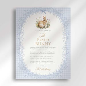 May include: A blue and white gingham background with a white border of flowers and a bunny rabbit holding an egg. The text reads "From the desk of The Easter Bunny" and a poem about the Easter Bunny.