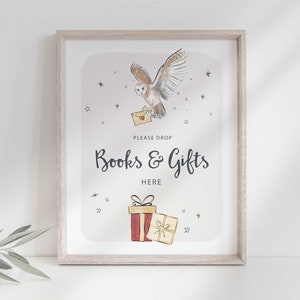 May include: A printable sign with a white owl carrying a letter, stars, and a gift box. The sign says "Please drop books & gifts here".
