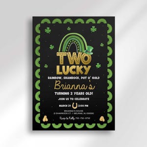 Printable Two Lucky St. Patrick's Day second birthday invitation with a green shamrock border and gold rainbow design, customized with the child's name and party details.