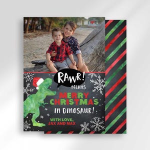 A Christmas card template showing front and back views with a dinosaur and photo of two boys.