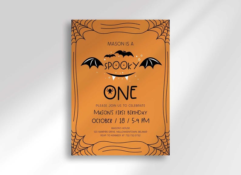 A full view of Mason's Halloween-themed 'Spooky One' first birthday invitation on an orange background with a black spiderweb border and hand-drawn bat illustrations.
