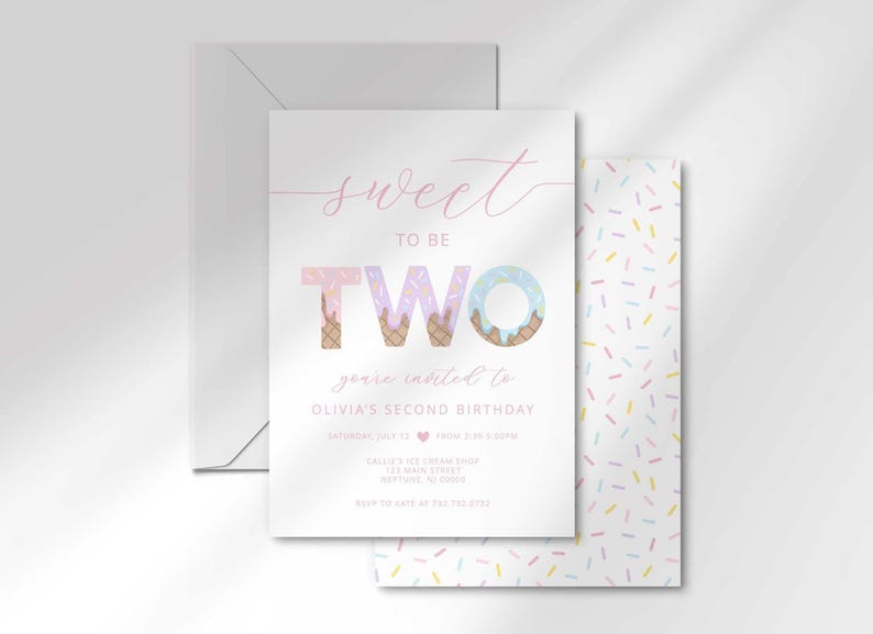 The ice cream-themed 'Sweet to be TWO' invitation for Olivia angled in front of its matching white envelope.