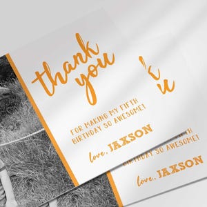 Angled stack of two printed thank you cards, both showing the same photo thank you card design for Jaxson's fifth birthday.