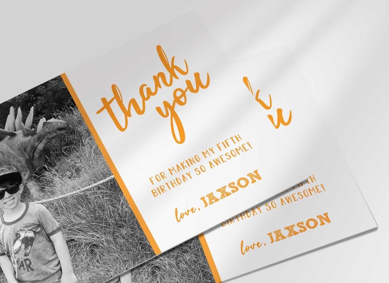 Angled stack of two printed thank you cards, both showing the same photo thank you card design for Jaxson's fifth birthday.