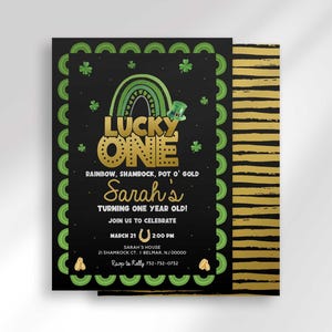 Styled mockup of the "Lucky One" invitation front layered over its black and gold striped card back, showing both sides of the printed design.