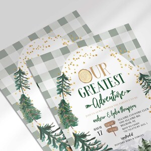 Angled close-up of Andrew and Lydia's camping-themed baby shower invitation, showing the pine tree and gold star illustrations with party details.