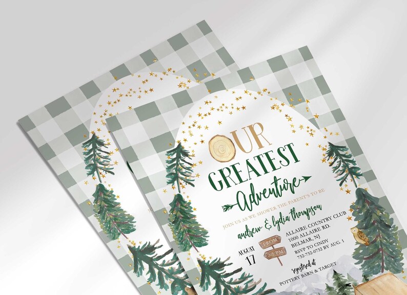 Angled close-up of Andrew and Lydia's camping-themed baby shower invitation, showing the pine tree and gold star illustrations with party details.