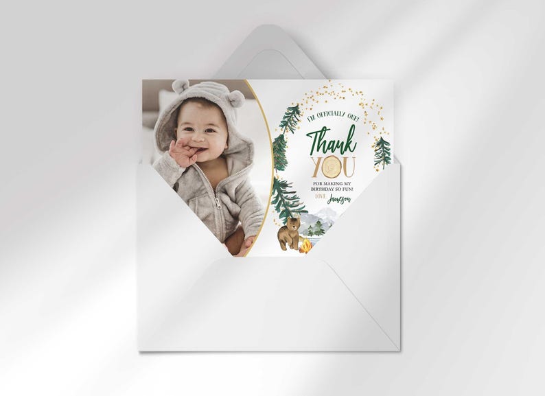 Jameson's camping-themed thank you photo card tucked inside its matching envelope, showing the baby's photo mockup and party thank you message.