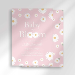 The 'Baby in Bloom' invitation for Calla Caravelli with a second card showing the daisy pattern back design peeking out behind it.