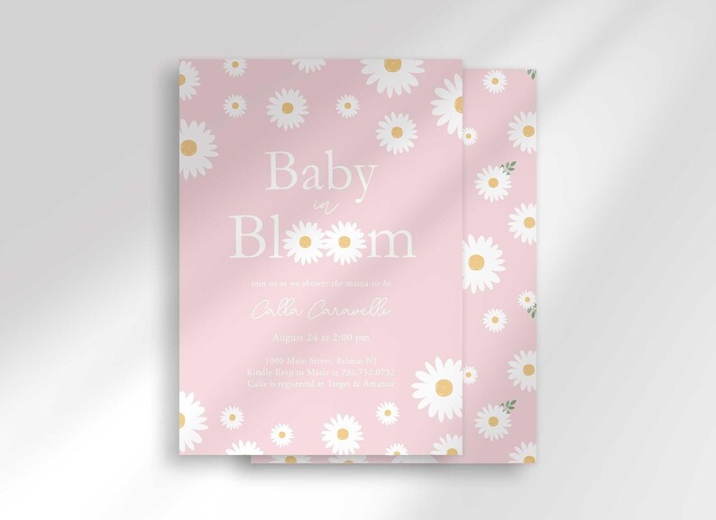 The 'Baby in Bloom' invitation for Calla Caravelli with a second card showing the daisy pattern back design peeking out behind it.