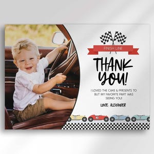 A mockup photo split with a candid photo of a smiling toddler in a vintage car on the left and a race car-themed "thank you" photo card on the right with checkered flags and a red "Finish Line" banner, reading "Thank you! I loved the cake & presents to but my favorite part was seeing you! Love, Alexander," with a row of colorful race cars along the bottom.