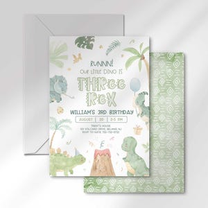William's dinosaur-themed third birthday invitation layered in front of its matching envelope and a second card showing a sage green geometric back design.