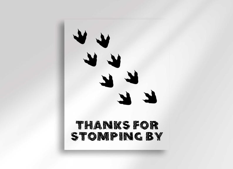 A vertical sign featuring black dinosaur footprints walking diagonally and text that reads Thanks For Stomping By.
