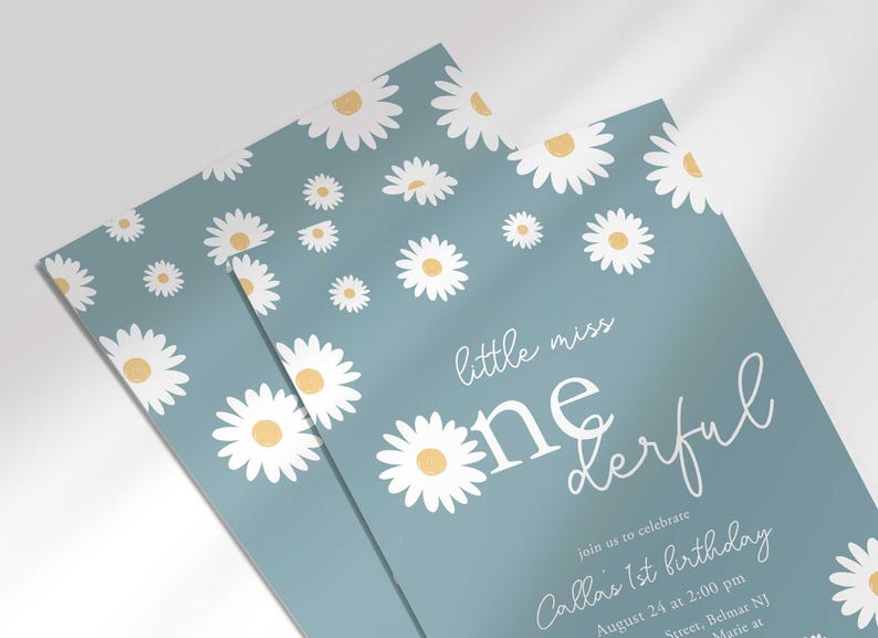 Close-up angled stack of two prints of the 'Little Miss ONEderful' daisy-themed invitation for Callie's 1st birthday, showing the print quality and daisy pattern detail.