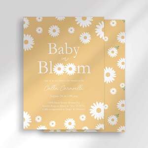 The 'Baby in Bloom' invitation for Calla Caravelli with a second card showing the daisy pattern back design peeking out behind it.