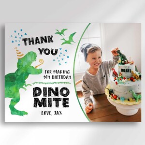 Primary listing photo of a Dino Mite dinosaur-themed birthday Thank You card with a photo insert of a boy decorating a dinosaur birthday cake, watercolor green T-Rex illustration and confetti, personalized text reading Thank You For Making My Birthday Dino Mite, Love Jax.