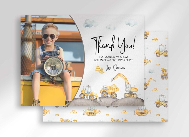 Damian's construction-themed thank you photo card with the boy's photo mockup layered in front of a second card showing a scattered dump truck and excavator back design.