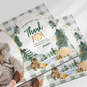 Angled close-up of Jameson's camping-themed thank you photo card with the baby's photo mockup, showing the pine tree and bear illustrations with the thank you message.