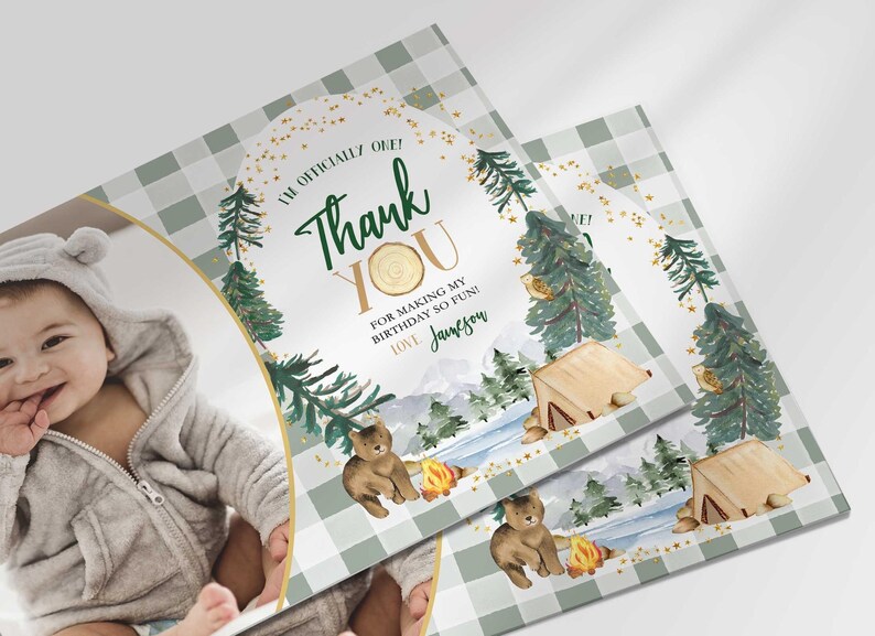 Angled close-up of Jameson's camping-themed thank you photo card with the baby's photo mockup, showing the pine tree and bear illustrations with the thank you message.