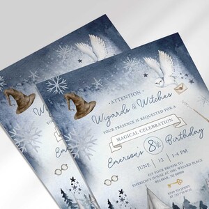 Angled stack of two prints of the wintery wizard-themed invitation for Emerson's 8¾ birthday, showing the print quality and snowflake details.