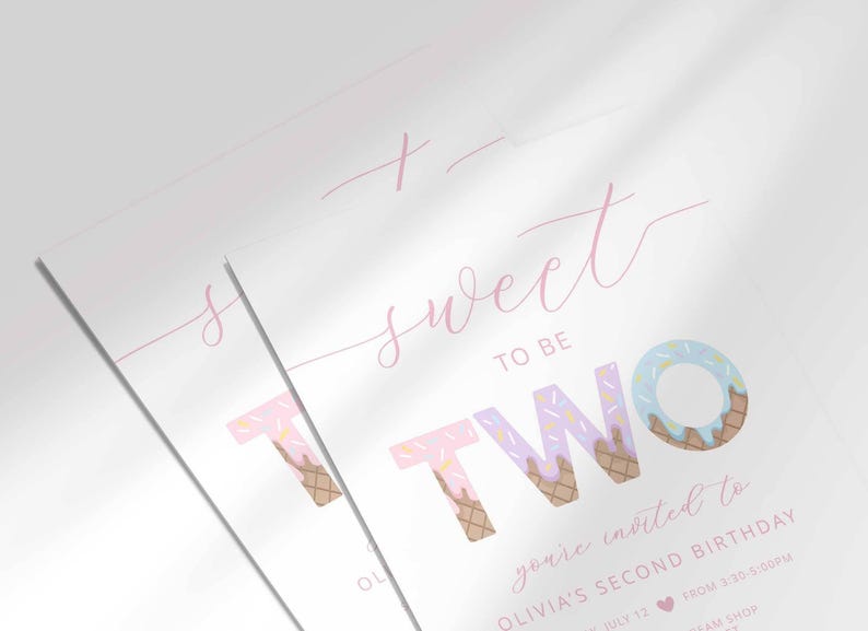 Close-up angled shot of the 'Sweet to be TWO' ice cream-themed invitation for Olivia's second birthday, showing the print quality and ice cream cone lettering detail.